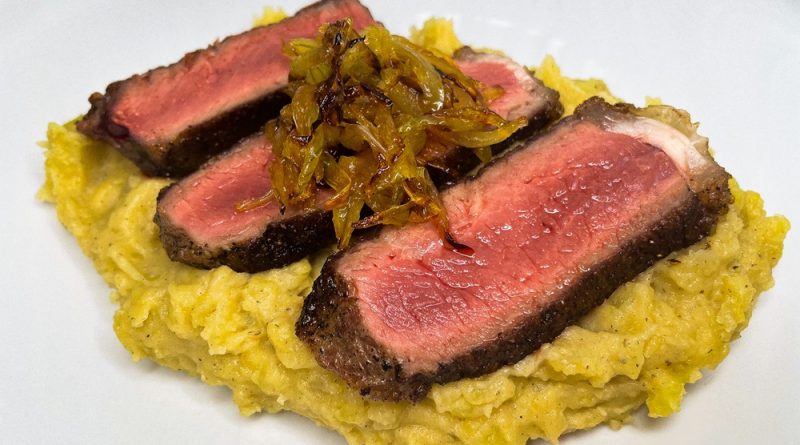 Sizzling Steak with Caramelized Onions and Mashed Potatoes