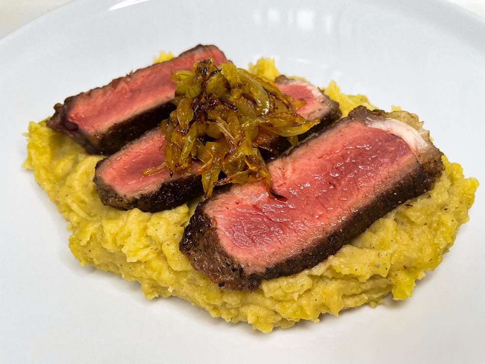 Sizzling Steak with Caramelized Onions and Mashed Potatoes